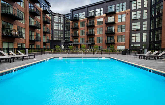 a swimming pool in front of a building