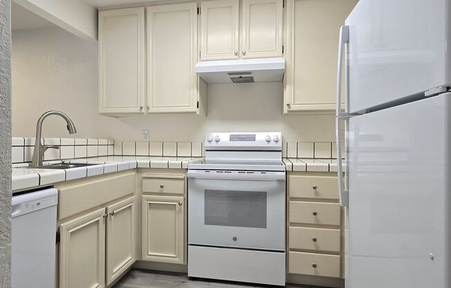 Large Downstairs Condo in Nice Community, New Wood Flooring, Fresh Paint, Garage, Great Location!