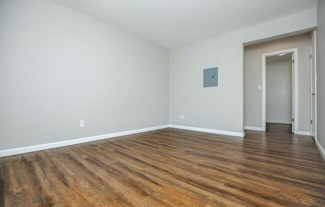 a large empty room with a wooden floor