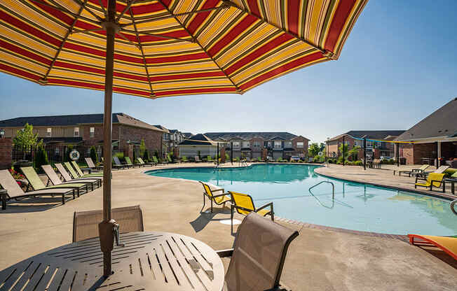 Patio Table with Sun Umbrella at the Pool Deck
