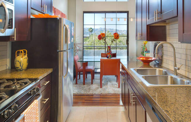 Apartment kitchen with stainless steel appliances and cabinets