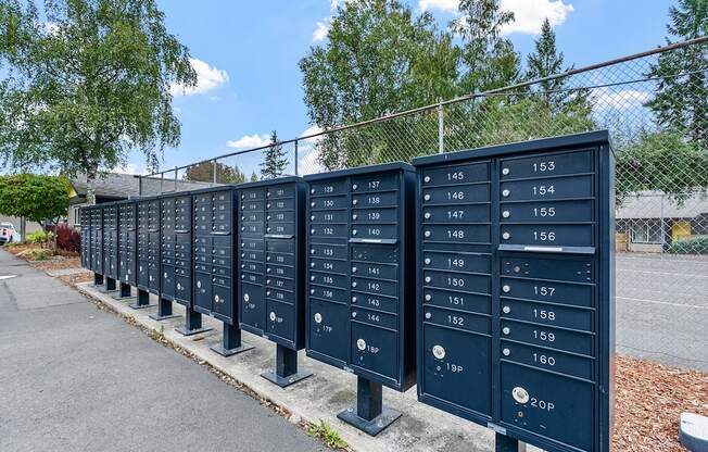 A row of mailboxes numbered from 145 to 160.