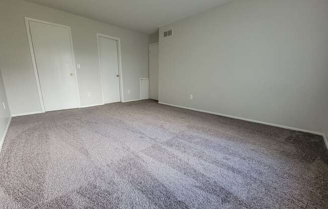 Large Bedroom with natural light at Garfield Commons Apartments in Clinton Township, Michigan