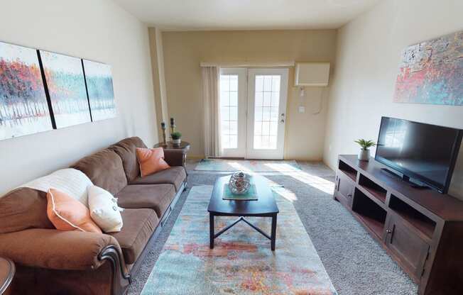 living room, furnished, patio door at Stonebridge Villas Apartments, Minot, North Dakota