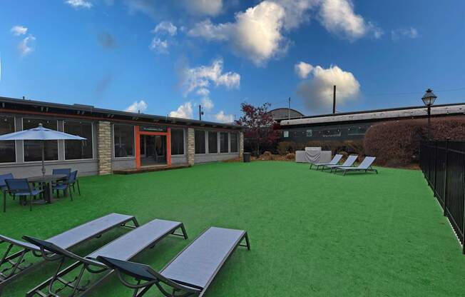 A sunny day at the outdoor seating area with tables and chairs.
