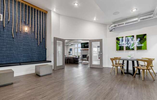 A room with a wooden floor and a blue wall with a white ceiling.