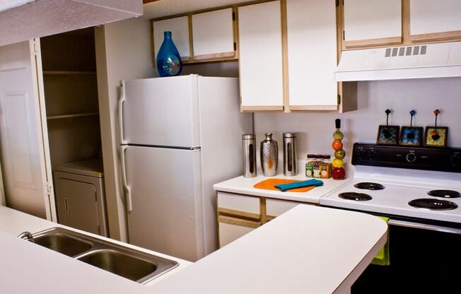 Kitchen with white cabinets and appliances