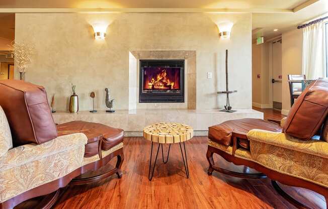 Clubroom with a fireplace and leather furniture