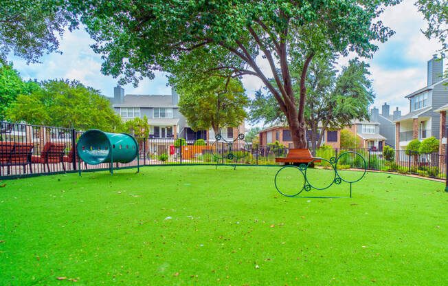 a park with a playground and a tree