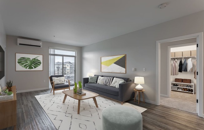 a living room with a grey couch and a coffee table