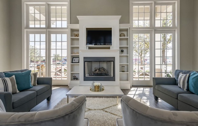 a living room with couches and a fireplace