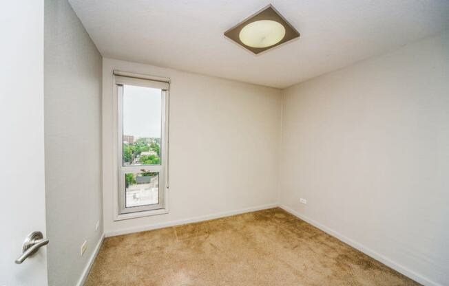 Bedroom with a long window and nice views