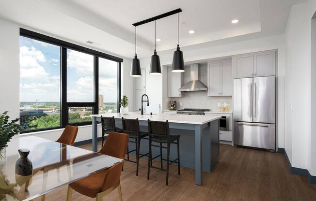 a rendering of a kitchen with a large island and stainless steel appliances