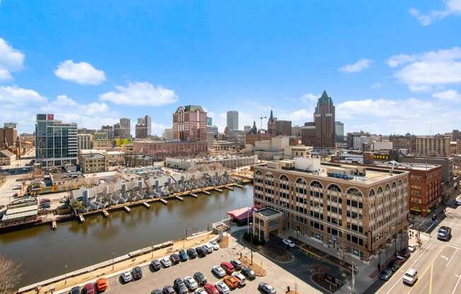 an aerial view of the city with a river