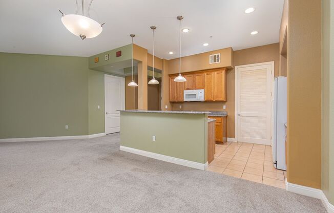 Upgraded 4th floor unit in upscale guard gated community just South of the Strip