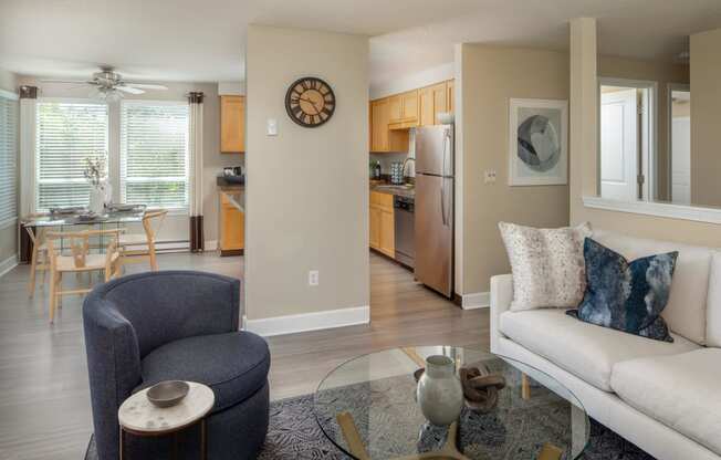 a living room with a couch and a glass table