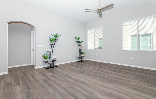 a room filled with furniture and vase of flowers