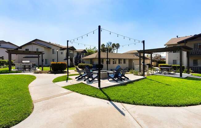 A park with a bench and a swing set.