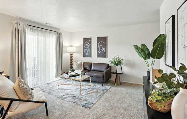 A living room with a grey couch and a coffee table.