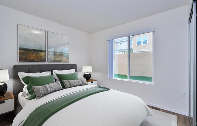 a view of a living room with a bed and a window