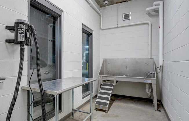 a laundry room with a sink and a machine in it