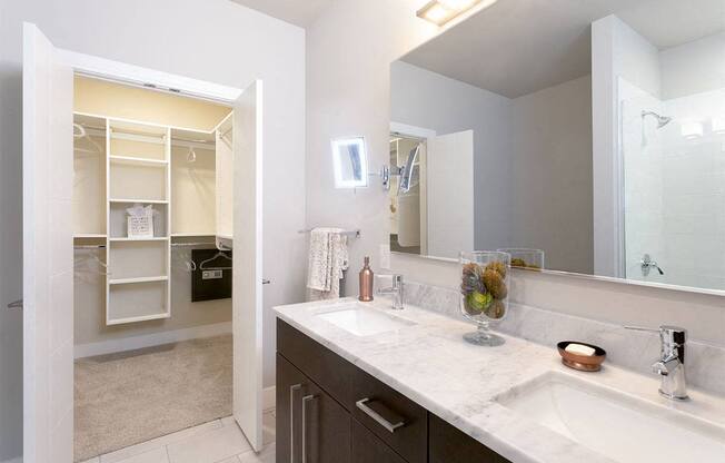a kitchen with a white counter top and a window at Aster Apartments, Beachwood, OH 