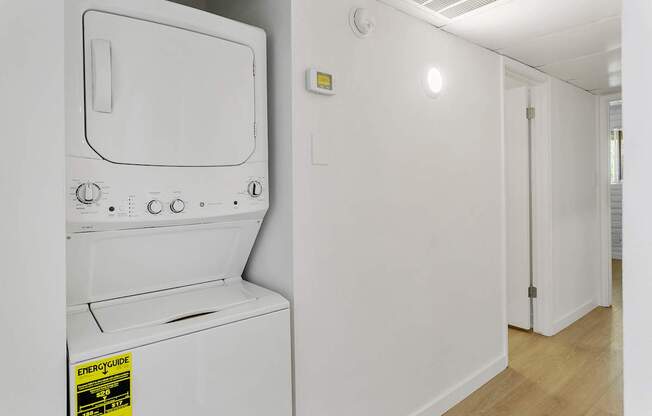 A white oven with a sticker on it.