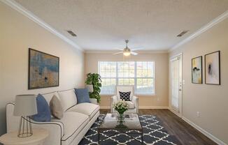 a living room with couches and a large window