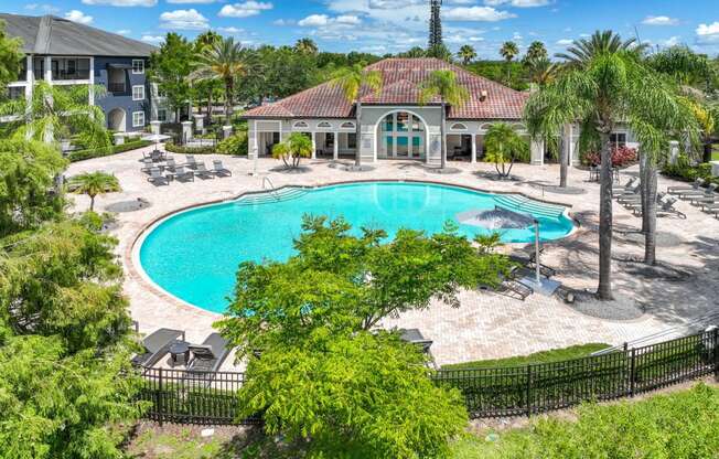 the pool and tanning area at Verano apartments