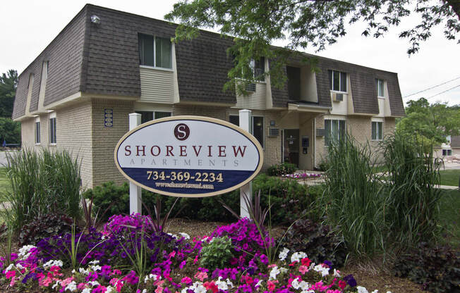 Shoreview Apartments Exterior monument sign with purple flowers