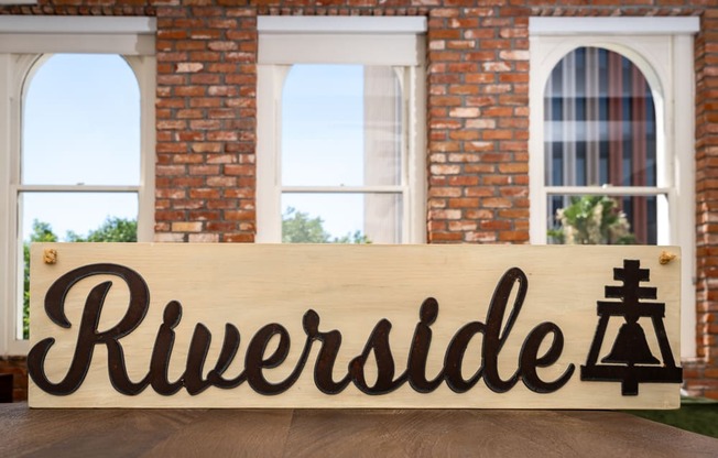 a wooden sign with the word rutherford in front of a building