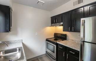 This is a photo of the kitchen in an upgraded 950 square foot, 2 bedroom apartment at Deer Hill Apartments in Cincinnati, OH.