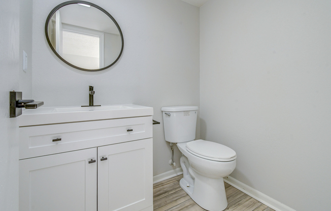 Vanity and toilet in townhome platinum bathroom interior at The Arbor in Blue Springs, Missouri