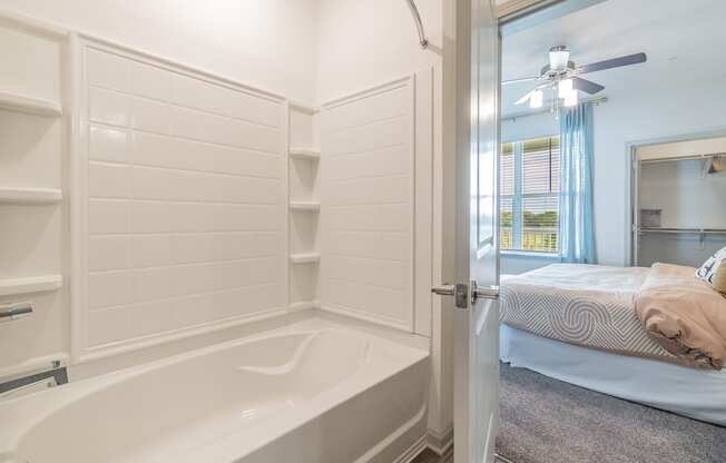 Spacious Shower & Tub With Built-In Shelving