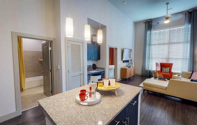 A kitchen with a table and chairs in the middle of the room.