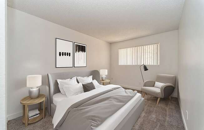 Model Bedroom with Carpet and Window View at Palmilla Apartments located in San Diego, CA.