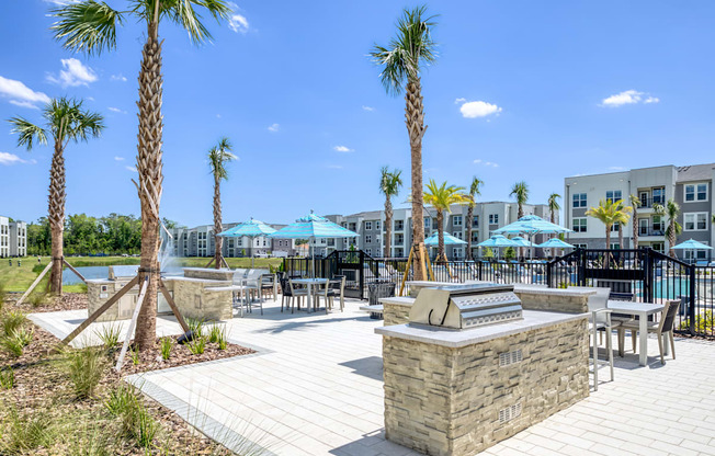 Poolside BBQ and seating area for residents and guests.