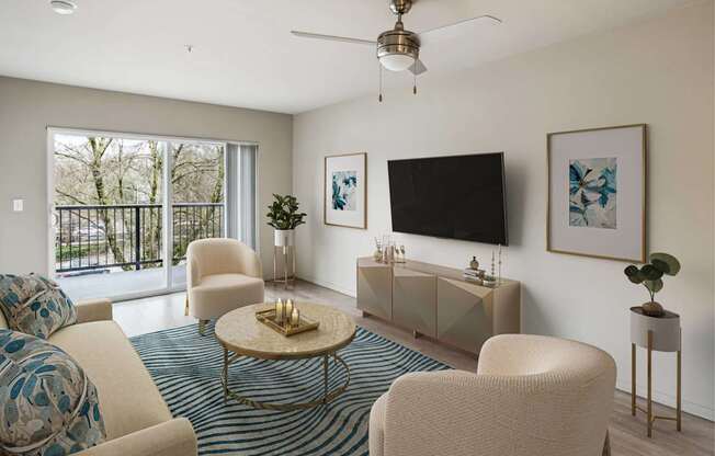 A living room with a white sofa, a coffee table, a TV, and a plant.