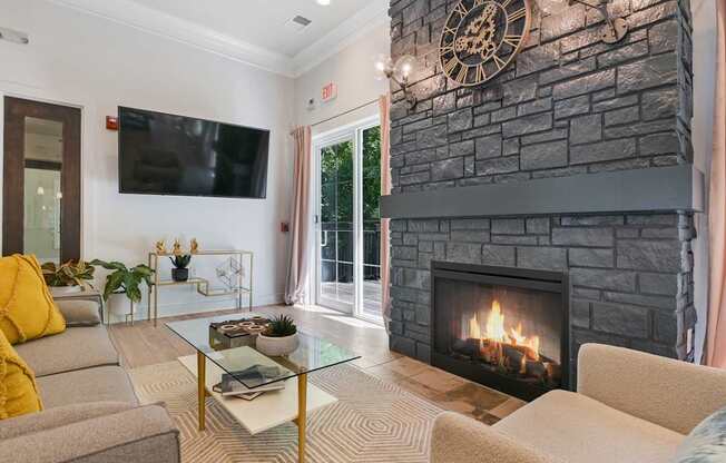 A living room with a flat screen TV at Poplar Glen Apartments, Columbia, MD, 21044.