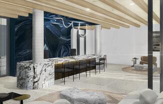 A striking leasing lounge welcomes you home with statement stone, layered seating, and art-driven design.