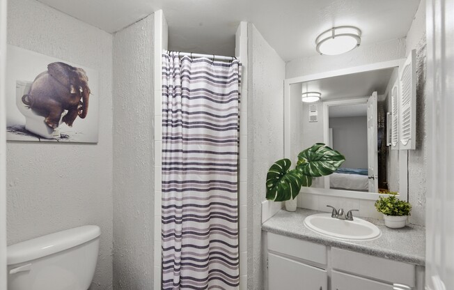 Welcome to Wymore 360 Apartments, where modern design meets functionality. Enjoy a stylish bathroom featuring sleek fixtures and a cozy ambiance. Make this inviting space your own today. Schedule a tour and see all that awaits!