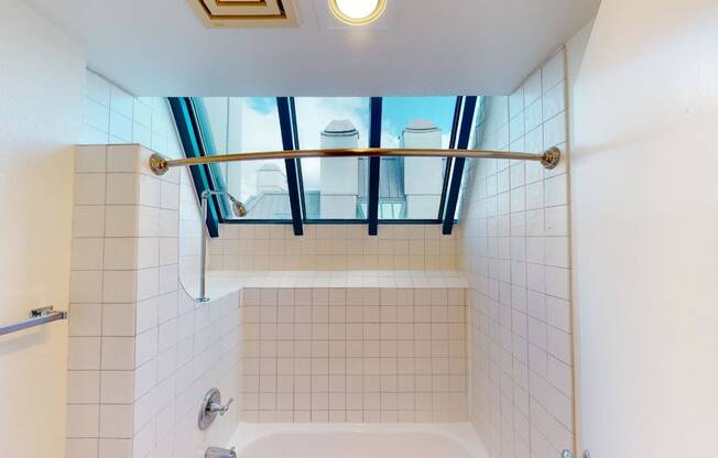 a bathroom with a shower and a tub