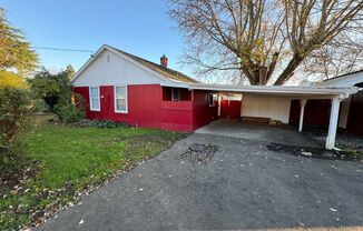 House with garage, carport, yard, & shed