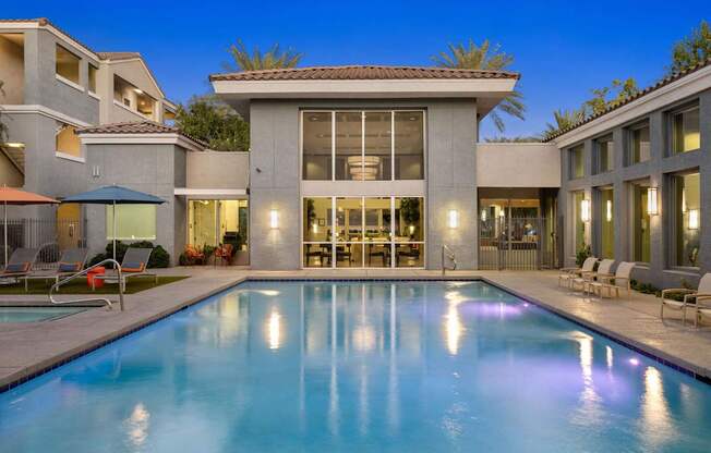A modern house with a pool in the backyard.