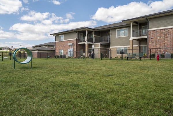 Private dog park with agility equipment at The Villas at Falling Waters townhomes in west Omaha NE