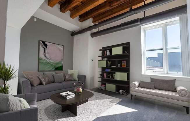 a living room with couches and a coffee table at Lowertown Commons Apartments, St. Paul, 55101