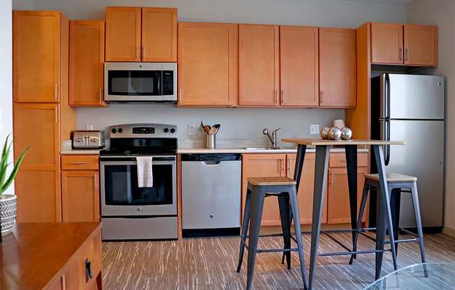 image of kitchen cabinets and stainless appliances