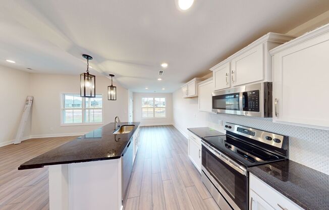 Open-Concept Home with Modern Upgrades Featuring Hardwood Flooring and Open Kitchen