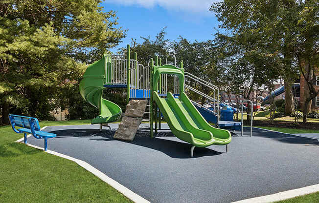 Community Playground with Two Slides at Middlesex Crossing Apartments located in Billerica, MA.