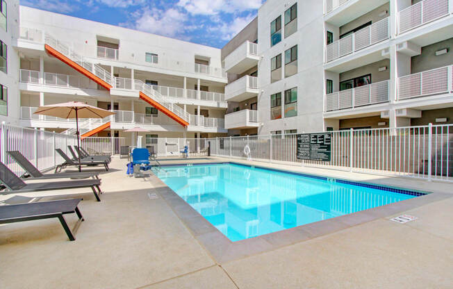 a swimming pool in the middle of an apartment building